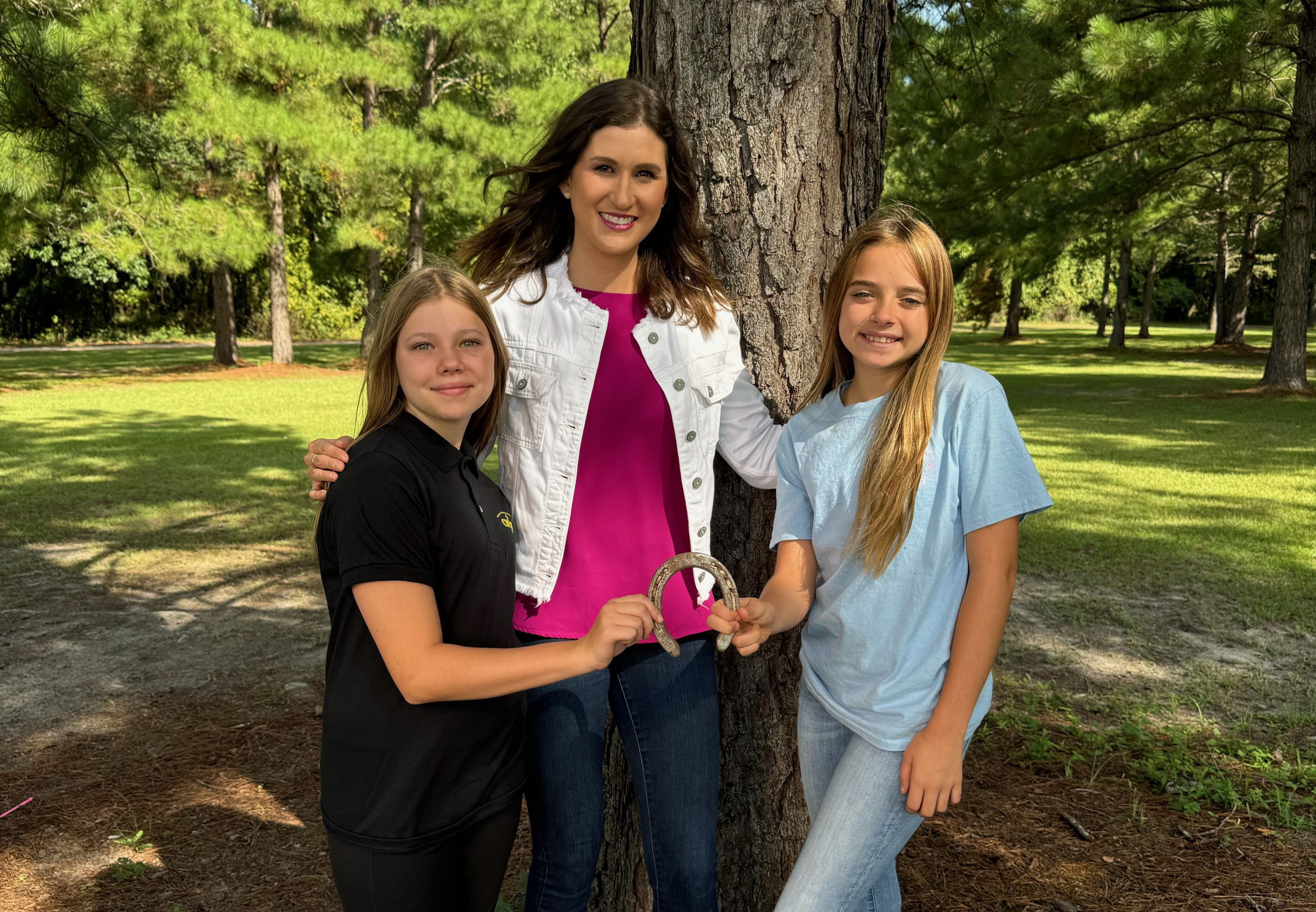 GPB Education producer and "Tiny Mic" host Ashley Mengwasser with student inventors in Thomasville.